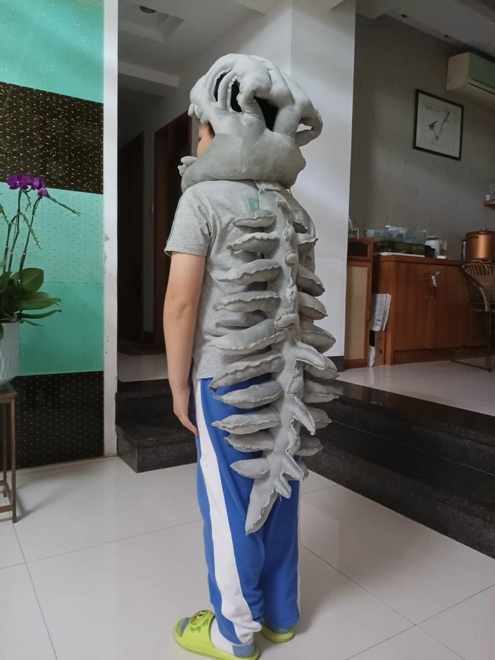 Oversized plush dinosaur head mask used for viral meme and comedy videos